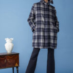 trench in check con tasche e colletto